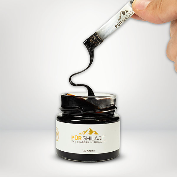 A jar of Pür Shilajit Resin with a black lid and a label that includes the brand name and the product name, placed on a white surface.