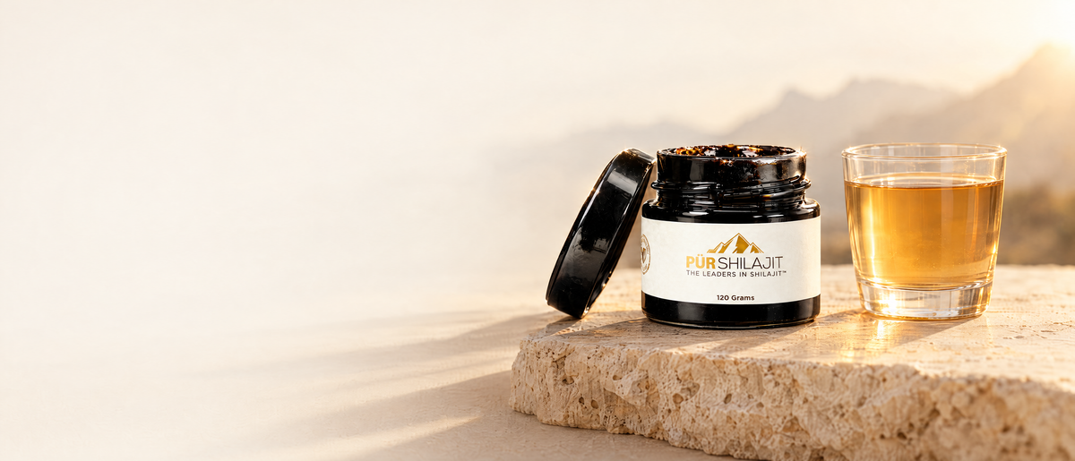 P&uuml;r Shilajit 120 g resin jar beside a glass of golden shilajit water in morning light
